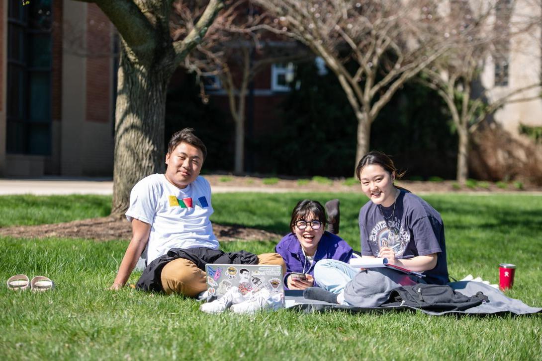 Students sitting on the Quad.